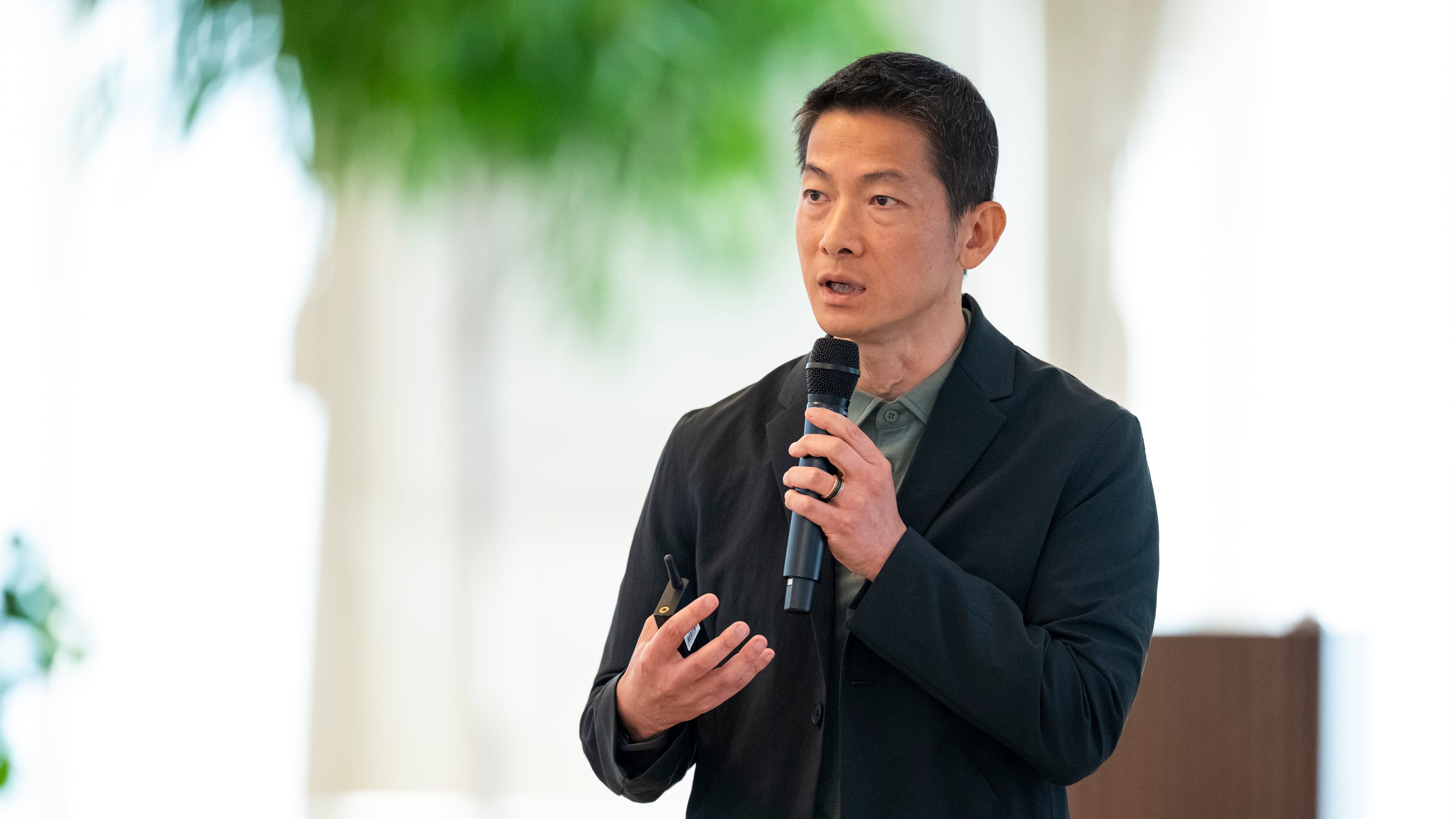 Peng Xiao, chief executive of G42, addresses an AI majlis at the Sea Palace in Abu Dhabi. - Abdulla Al Bedwawi / UAE Presidential Court
