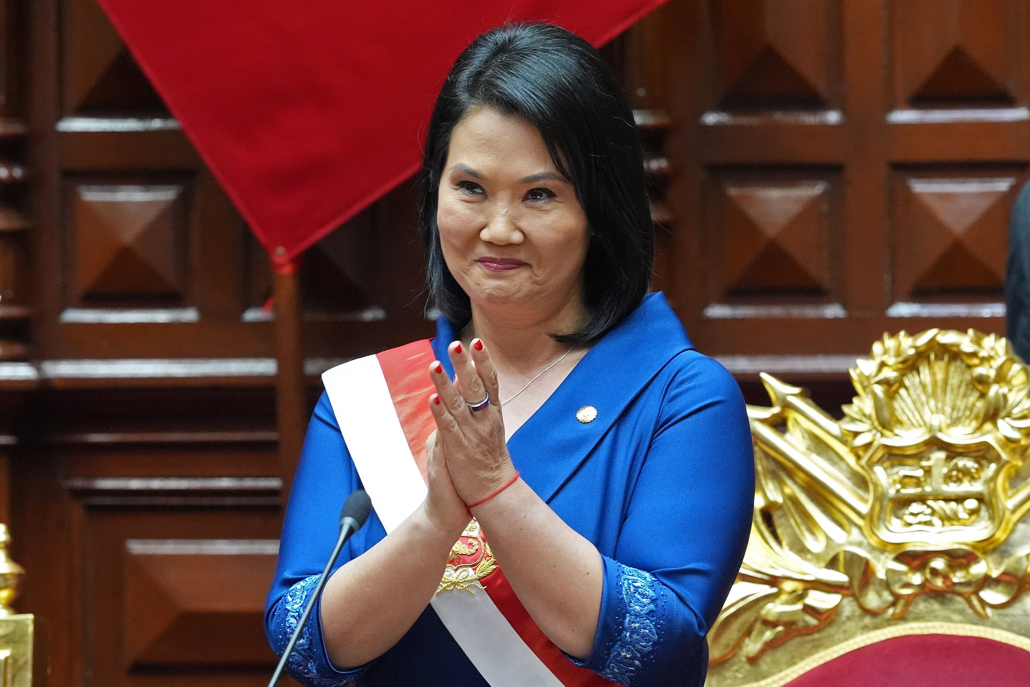 Peru's President Keiko Fujimori applauds after being sworn in in Lima, July 28, 2026. - GUADALUPE PARDO/AFP