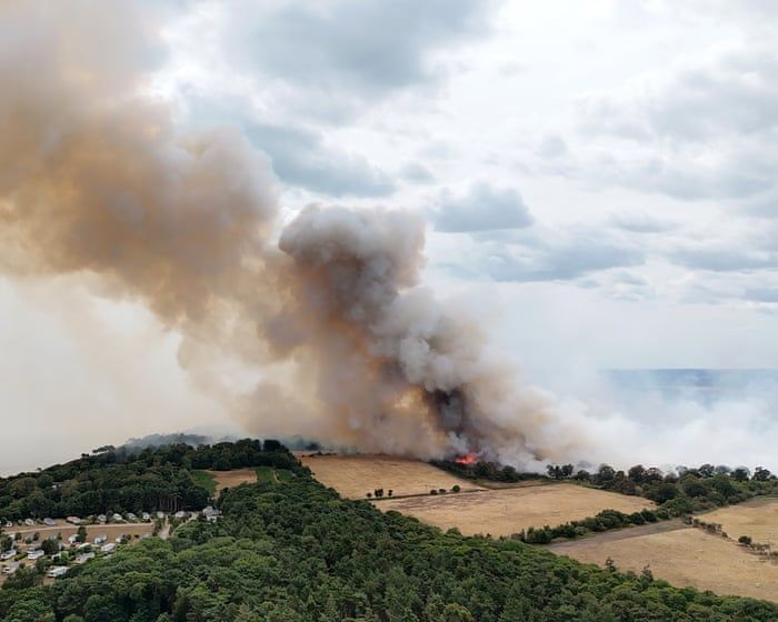 Smoke rises from a wildfire at Dunwich Heath on the Suffolk coast. - Joe Giddens/PA