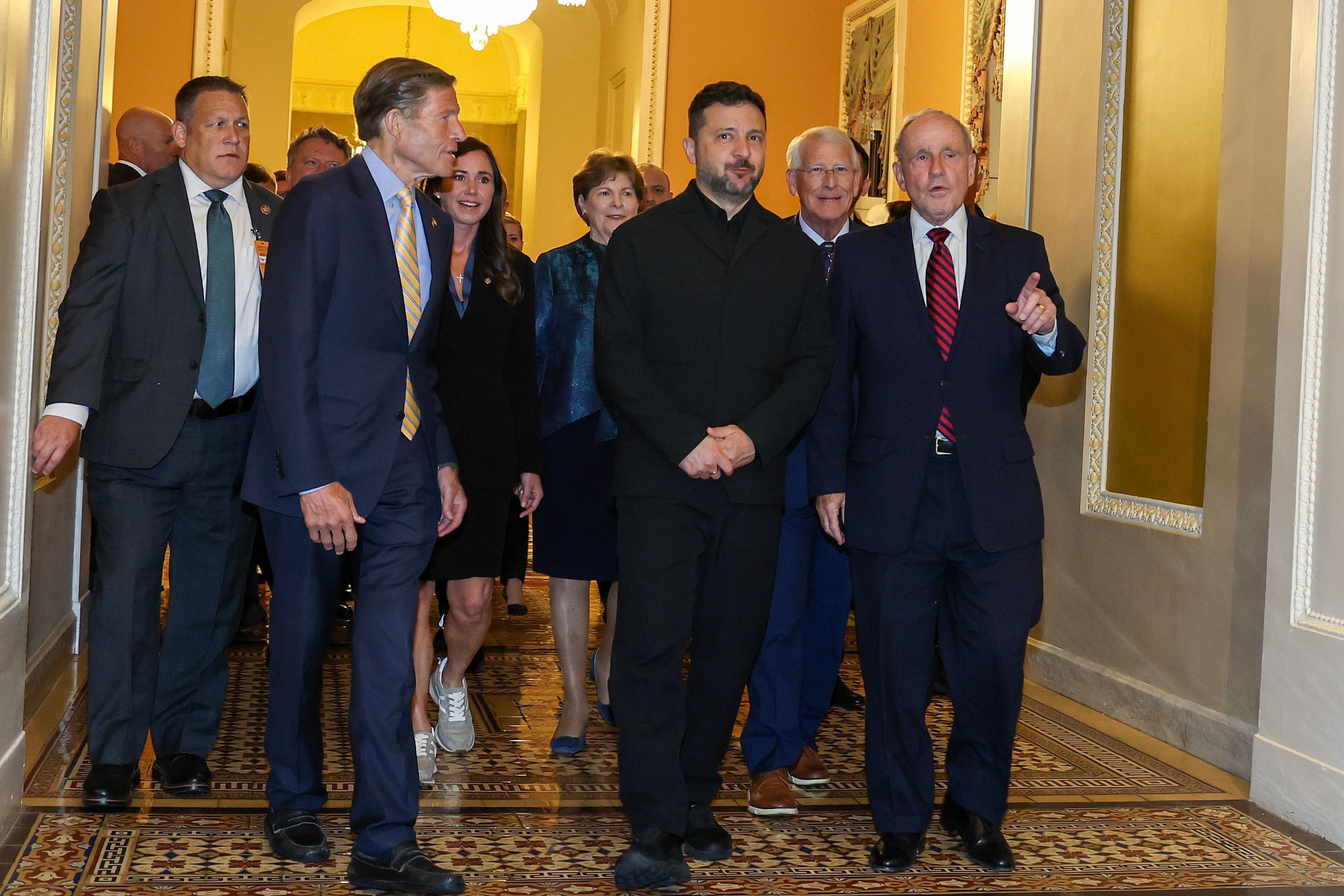 U.S. senators accompany Ukrainian President Volodymyr Zelenskyy to a meeting at the U.S. Capitol in Washington on July 28. - theglobeandmail.com