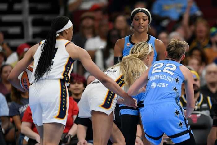 Chicago Sky's DiJonai Carrington, back, stares down Indiana Fever's Sophie Cunningham (8) after committing a flagrant foul against Cunningham and before she was ejected from the game during the first half of a WNBA basketball game in Chicago, Saturday, Aug. 8, 2026. - AP Photo/Paul Beaty