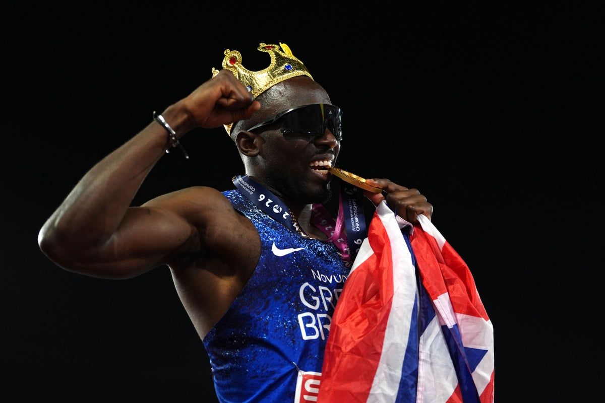 Romell Glave celebrates after sealing the men's 100m title in Birmingham. - Annabel Lee-Ellis/PA