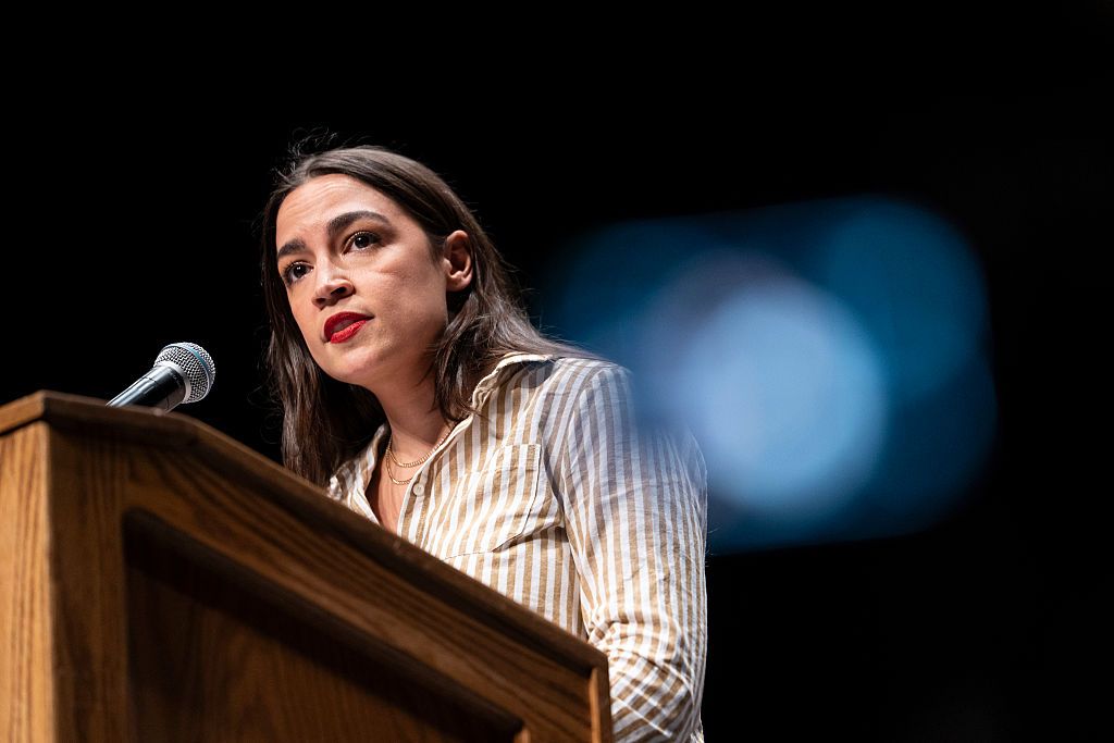 Rep. Alexandria Ocasio-Cortez speaks at The People v. The Powerful rally at the Detroit Opera House on July 18, 2026. - Sarah Rice/Getty Images