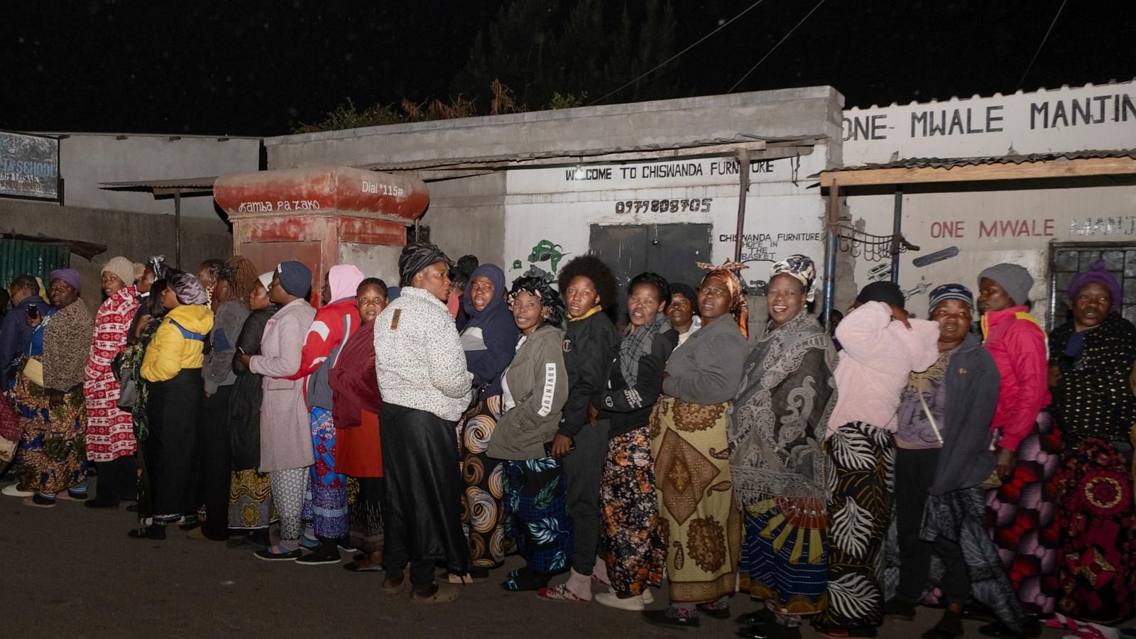 Zambians queue outside a polling station on the outskirts of Lusaka, Zambia, on Aug. 13, 2026. - AP Photo/Anita Reed