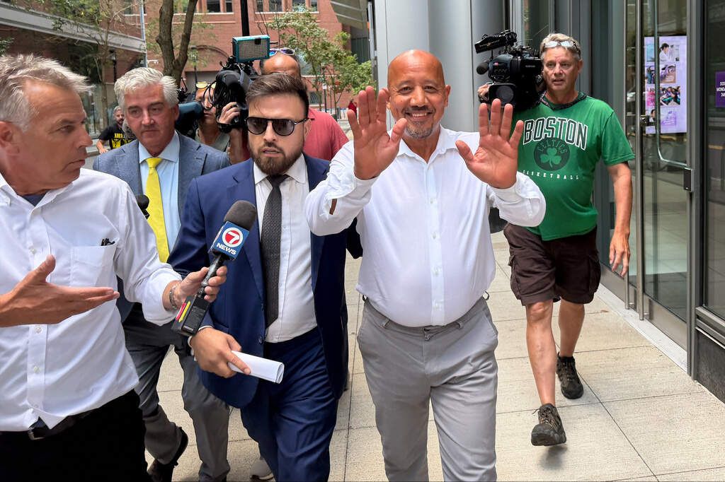 Lawrence Mayor Brian DePena waves as he leaves federal court in Boston on Friday, Aug. 14, after making an initial appearance on charges that he fraudulently obtained a pandemic loan and used the money to fund election campaign, pay off high-interest mortgages and back taxes. - Michael Casey/AP