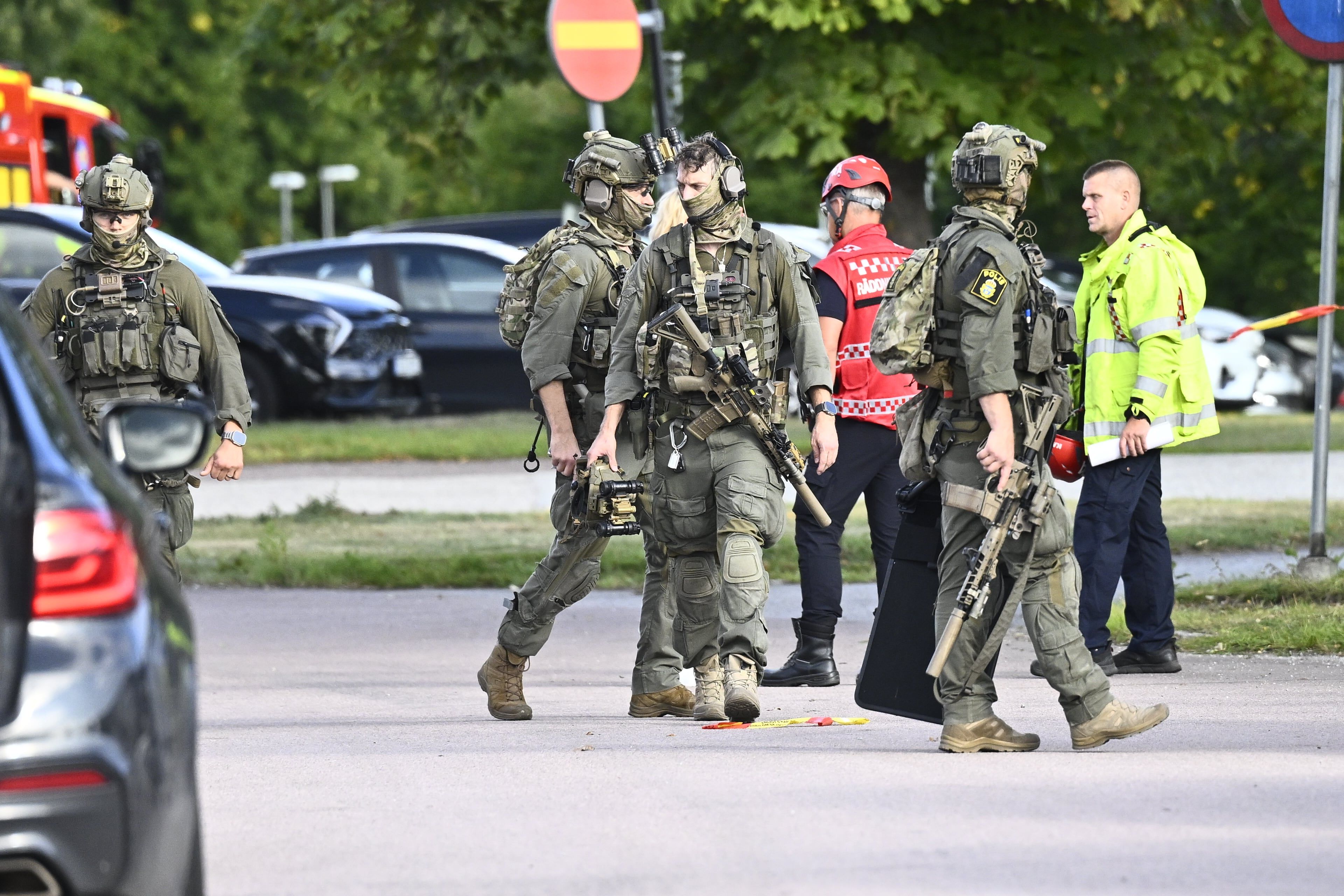 Police and emergency personnel outside Brinellskolan during a major emergency response after a man with a sword reportedly injured several people at the school in Fagersta, Sweden, Friday, Aug. 21, 2026. - Fredrik Sandberg/TT News Agency via AP