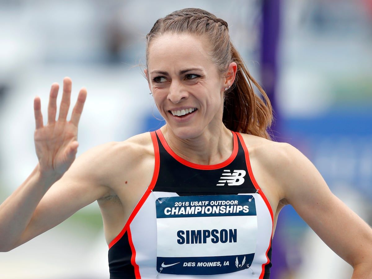 Jenny Simpson waves to a fan after winning her heat in the women's 1,500-meter run at the U.S. Championships athletics meet in Des Moines, Iowa, on June 21, 2018. - AP Photo/Charlie Neibergall