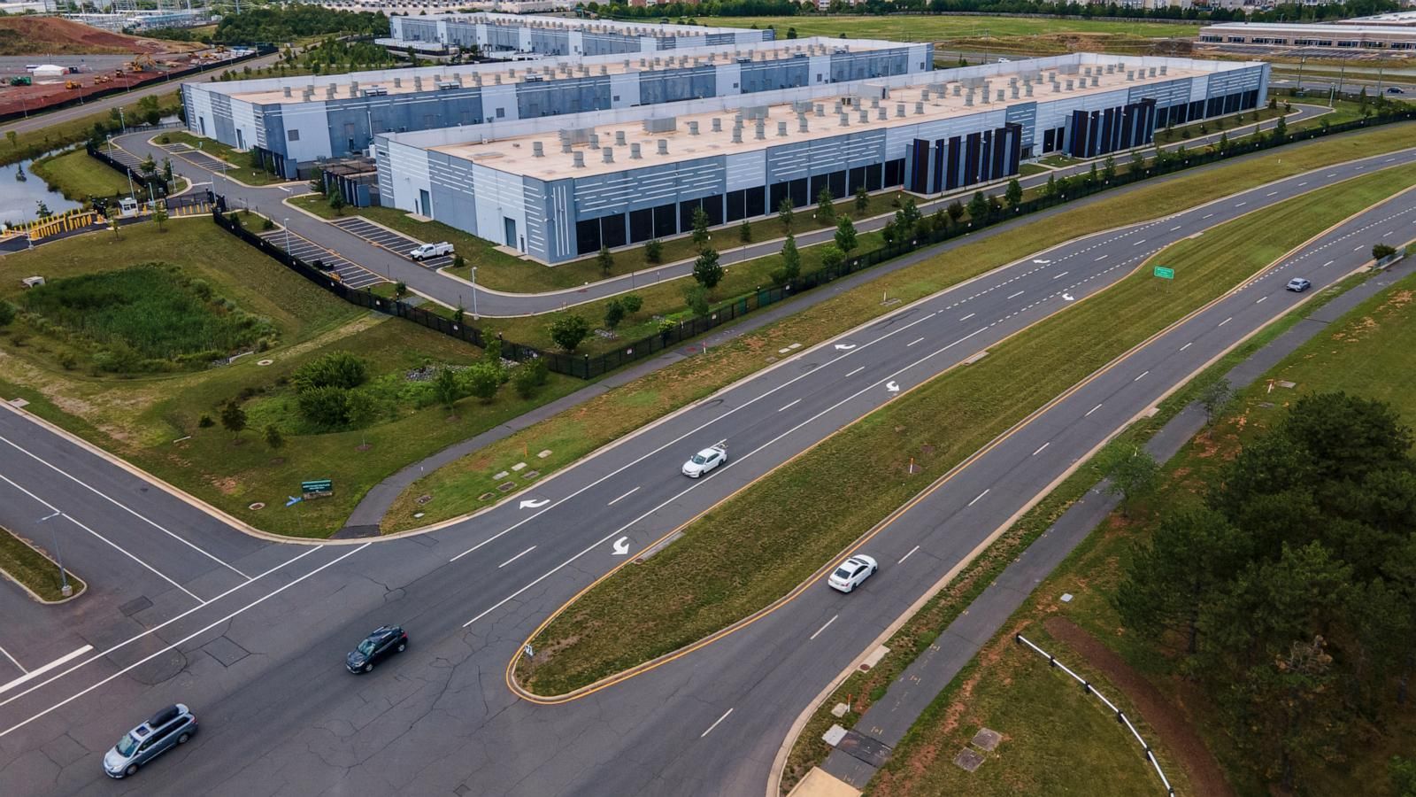 Cars drive past data centers in Ashburn, Virginia, on July 16, 2023. - AP Photo/Ted Shaffrey