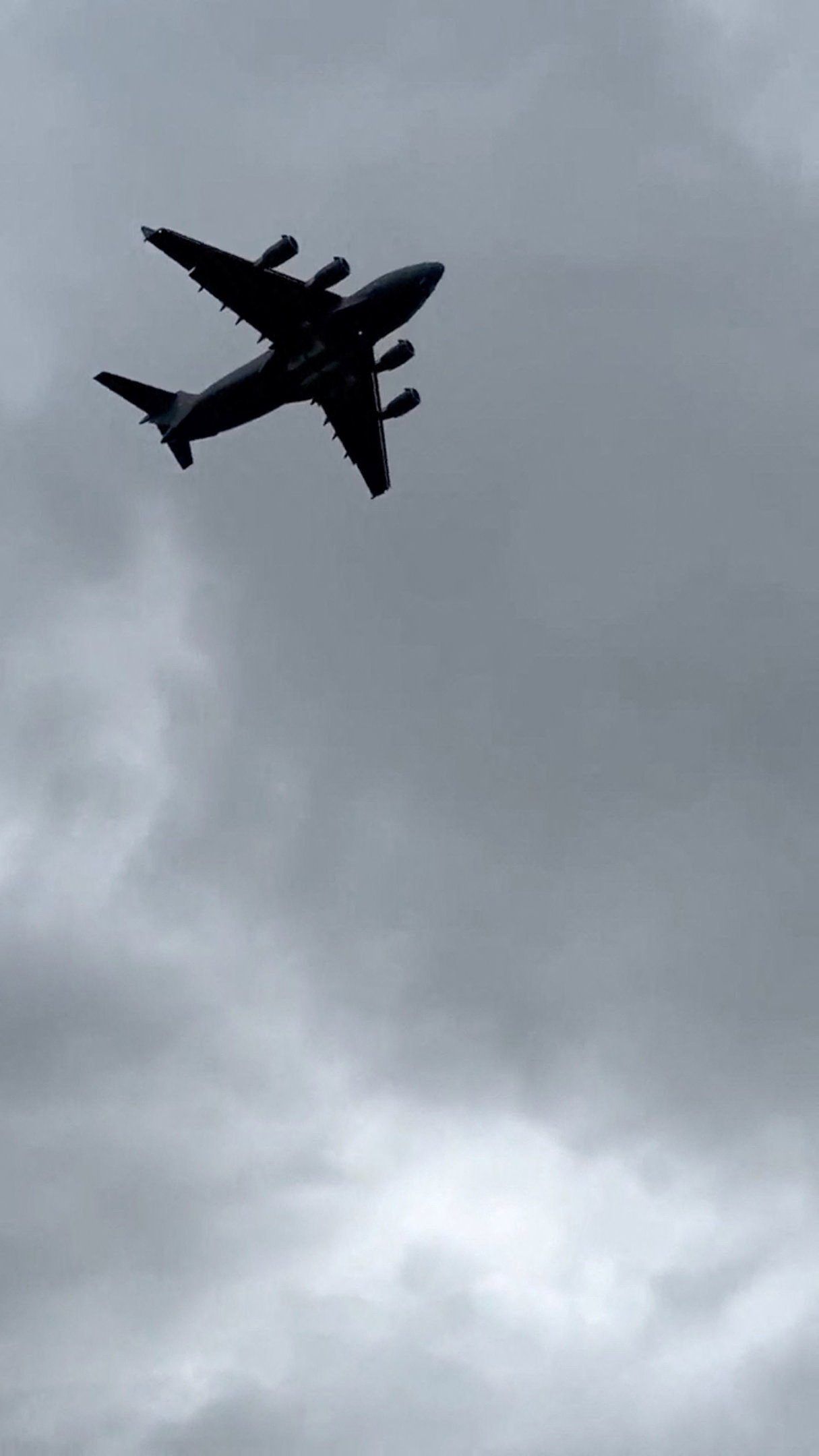 A U.S. military transport plane, identified as a Boeing C-17A Globemaster III, approaches Moscow's Vnukovo airport on Tuesday morning. - Social media, UGC via Reuters