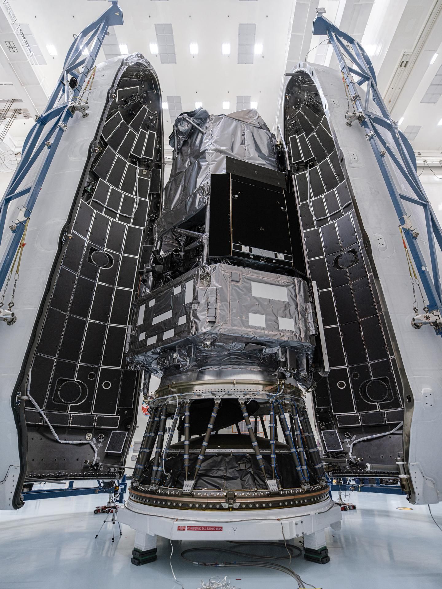 Teams encapsulate NASA’s Nancy Grace Roman Space Telescope in its payload fairing at Kennedy Space Center ahead of launch preparations. - NASA/Sydney Rohde (Rocz)