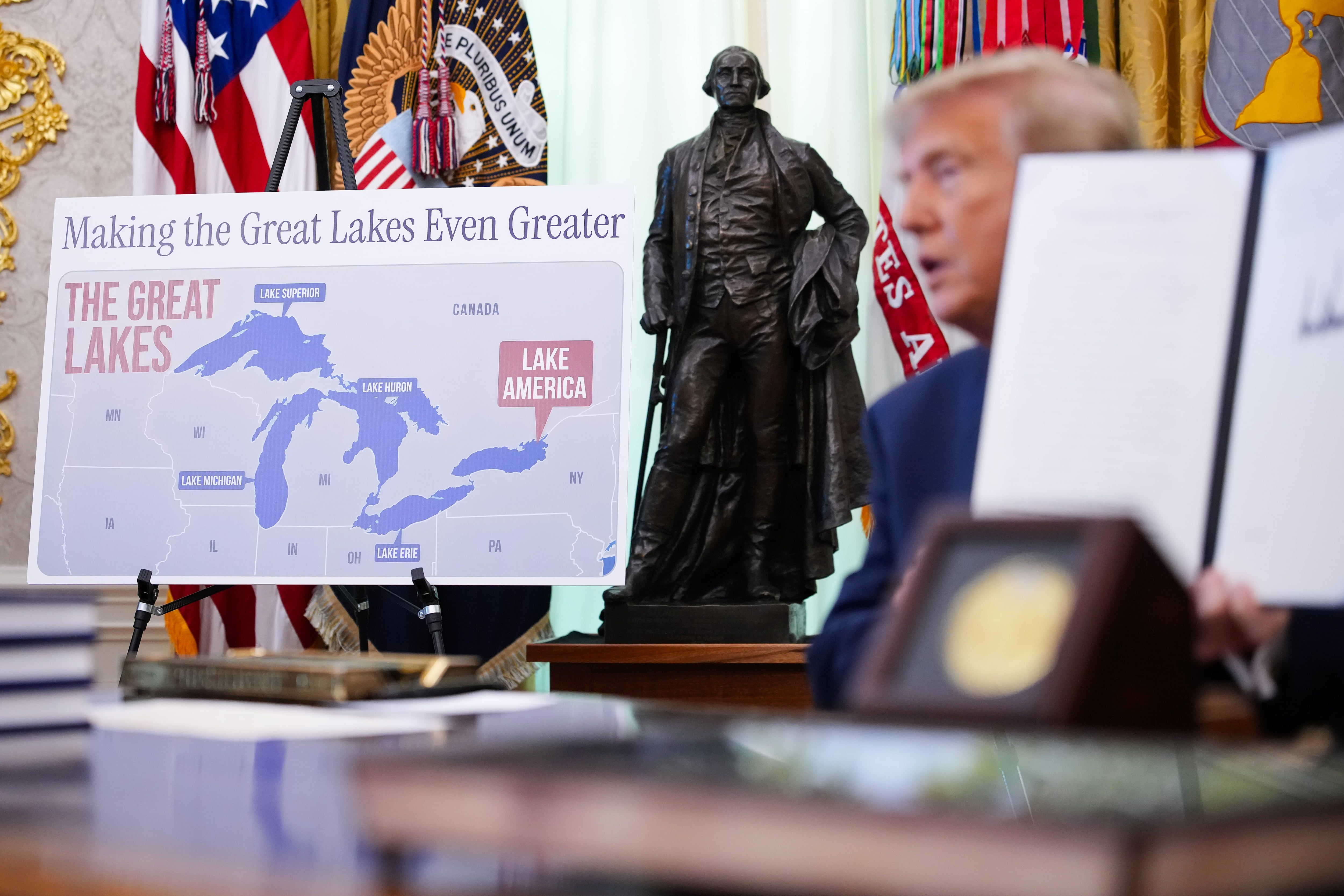 A map naming Lake Ontario as 'Lake America' is displayed as U.S. President Donald Trump signs an executive order during an event in the Oval Office of the White House on Aug. 27. - theglobeandmail.com
