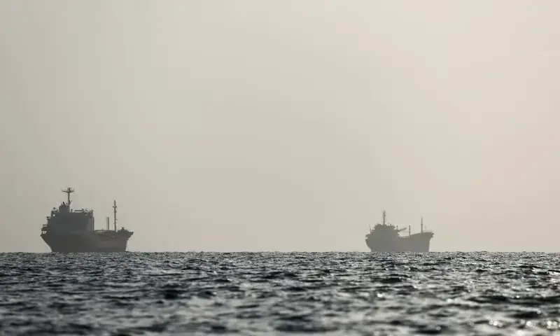 Vessels in the Strait of Hormuz are visible near the beach of Bandar Abbas, Iran. - Reuters