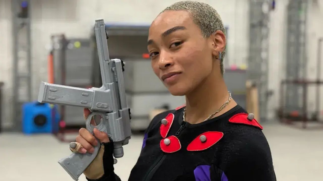 Intergalactic: The Heretic Prophet actor Tati Gabrielle smiles while holding a prop weapon during the cinematic shoot. - Naughty Dog