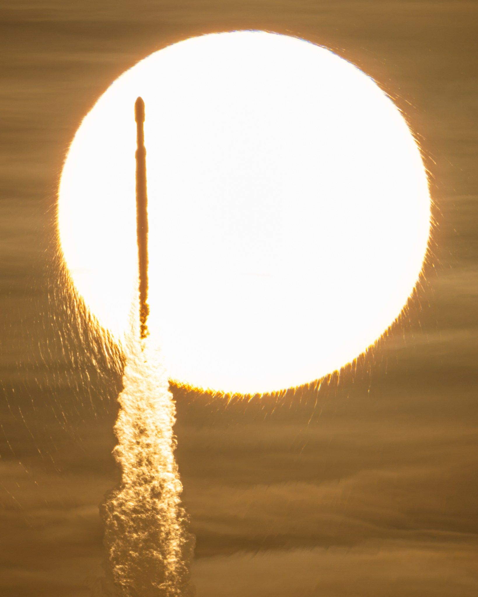 A SpaceX Falcon Heavy rocket carrying NASA's Nancy Grace Roman Space Telescope transits the Sun during launch from Kennedy Space Center on Aug. 30, 2026. - NASA/John Kraus