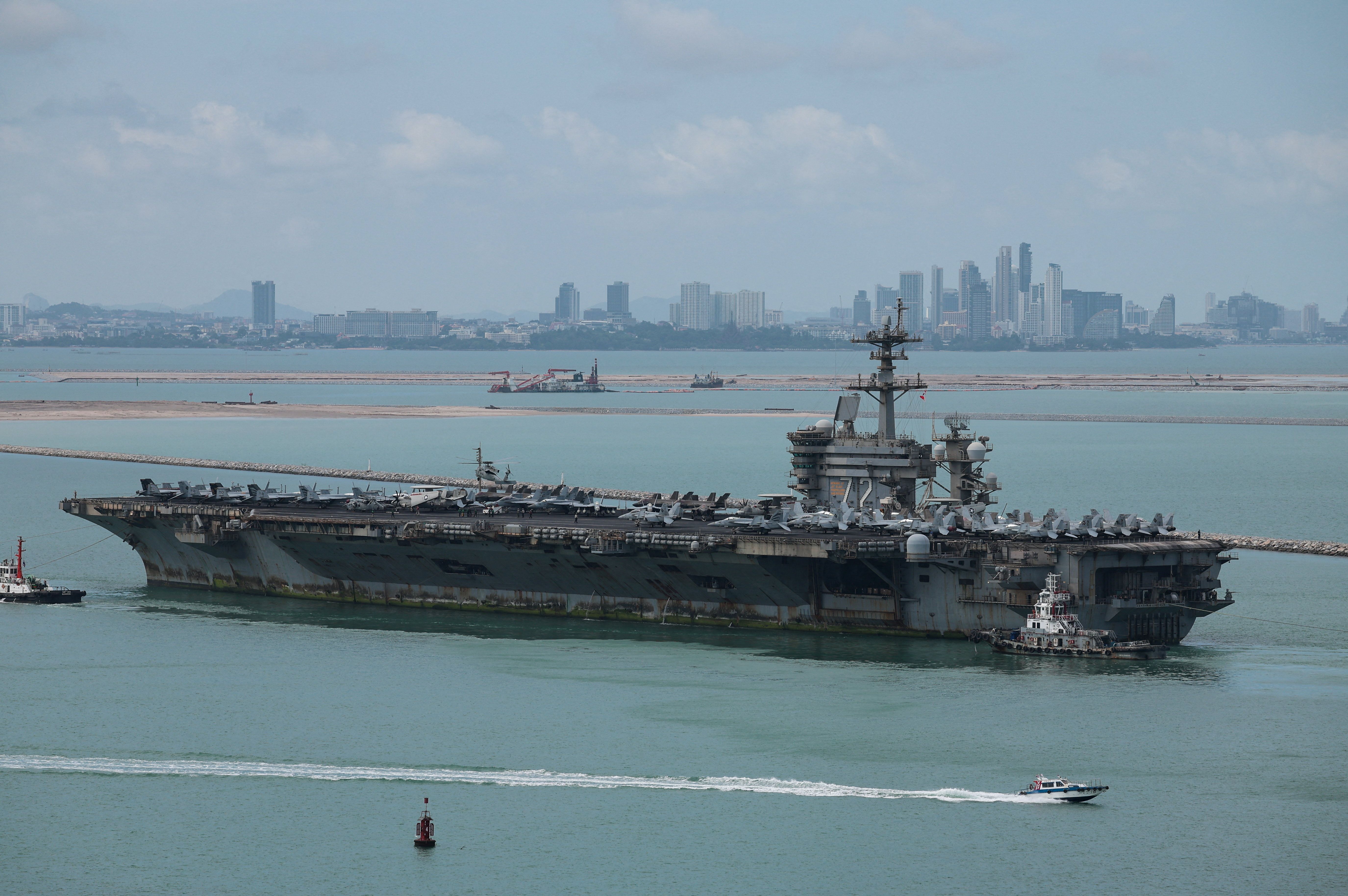 The Nimitz-class aircraft carrier USS Abraham Lincoln arrives at Laem Chabang Port, Thailand, with the Pattaya skyline in the background, on Sept. 2, 2026. - Chalinee Thirasupa/Reuters