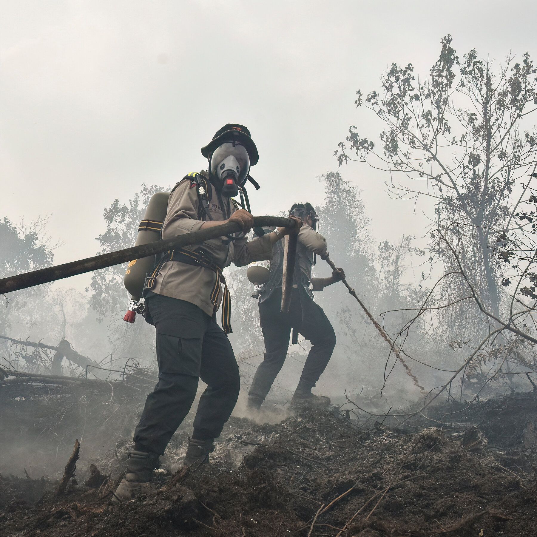 Fighting back a fire burning in peatland in Sumatra, Indonesia, last week. - nytimes.com