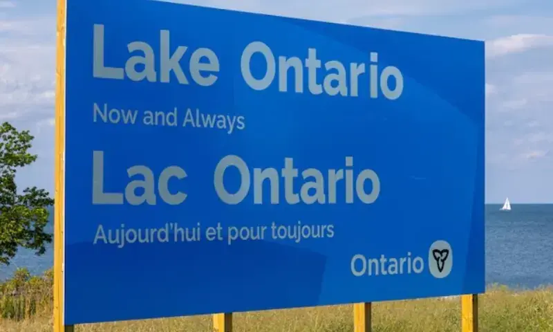 A sign reading “Lake Ontario, Now and Always,” unveiled by Ontario Premier Doug Ford at Fifty Point Conservation Area near Grimsby, Ontario, Canada, on August 29, 2026. - Reuters