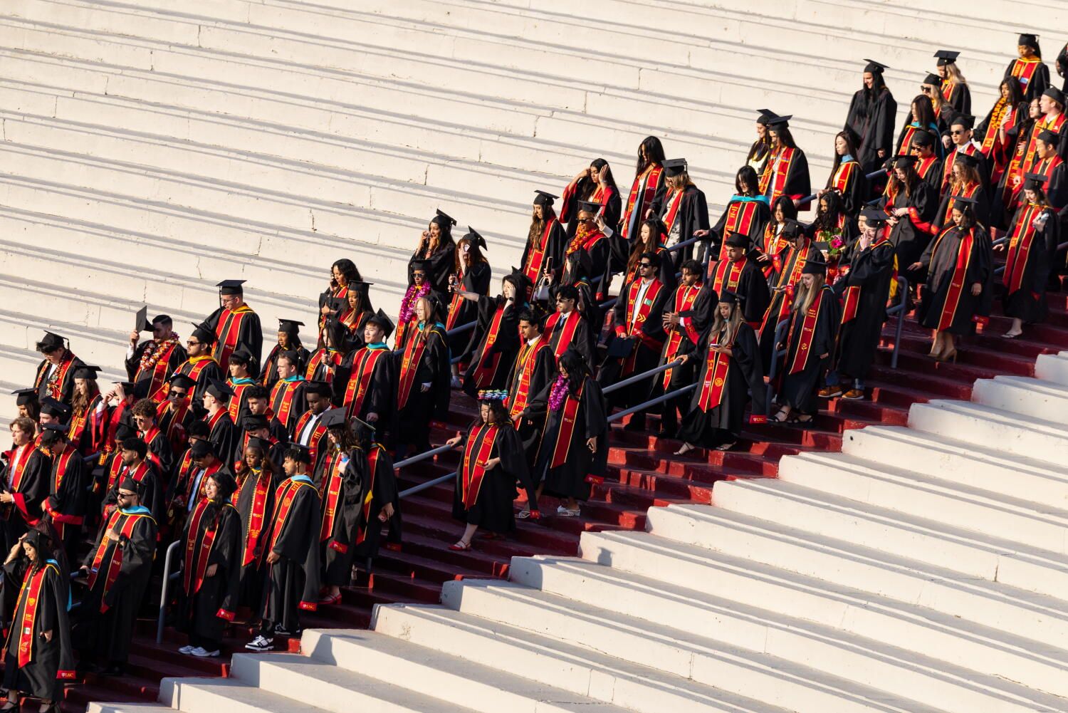 USC graduates process into the Los Angeles Memorial Coliseum for their 2026 commencement ceremony in Los Angeles on May 14, 2026. - Jason Armond / Los Angeles Times
