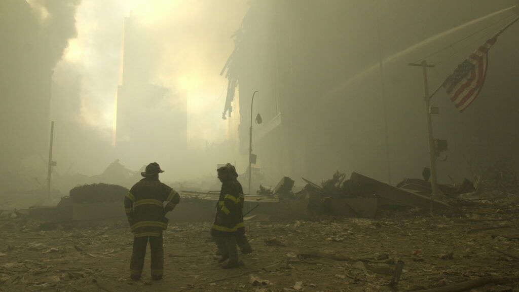 Emergency workers at Ground Zero on the evening of Sept. 11, 2001. - AP
