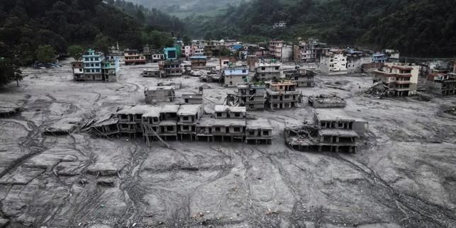 Mud-covered homes after flash floods and a debris flow in Devighat, Nuwakot district, Nepal, on Aug. 29, 2026. - Rajesh Kumar Singh / AP Photo
